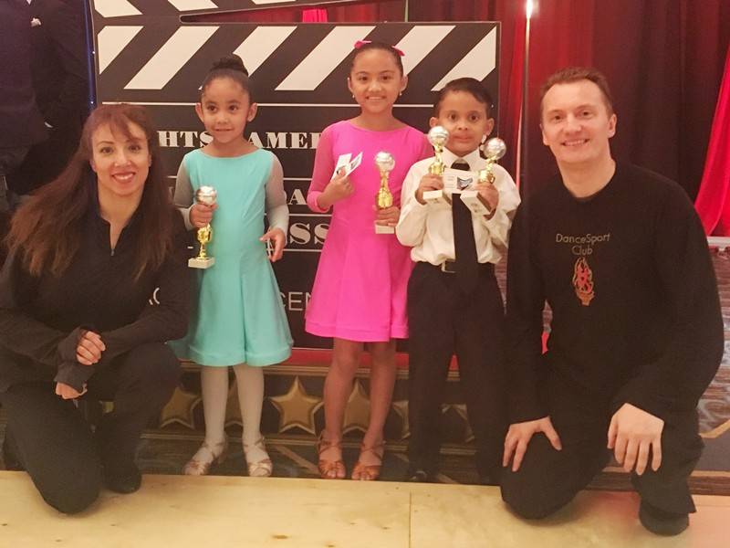 Denis and Jeanette with competitive students at dance competition in Houston